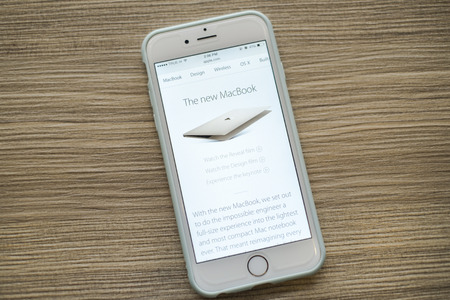 CHIANG MAI, THAILAND - March 10, 2015: Apple Computers website close up details on Apple iPhone 6 with the New Macbook Apple laptop.のeditorial素材