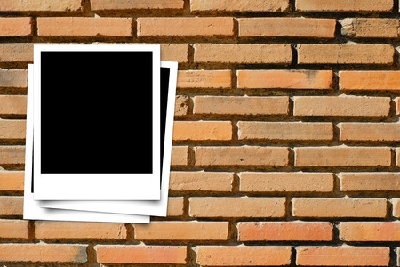 Photo frame on Brick wall texture の写真素材