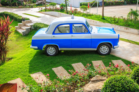 Blue vintage car in the park.のeditorial素材