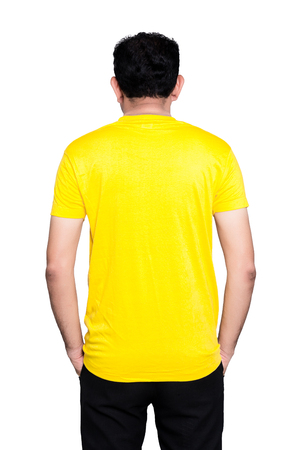 Handsome  man in a blank rear yellow t-shirt  isolated on white background.の写真素材