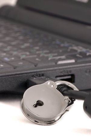 Padlock on a usb cable connected to computer