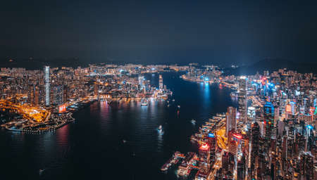 Aerial view of Hong Kong Downtown. Financial district and business centers in smart city, technology concept. Top view of skyscraper and high-rise buildings at night.のeditorial素材