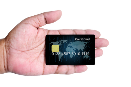 Credit Card holded by hand, close up, isolated on a white backgroundの写真素材