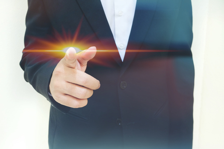 Business man press something on white backgroundのeditorial素材