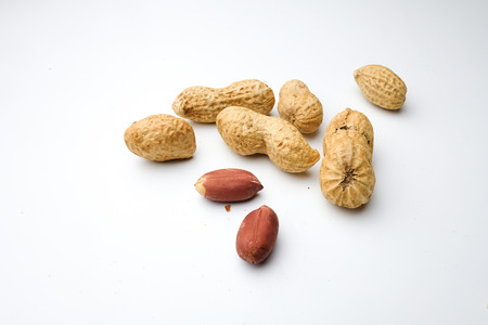Peanuts, isolated on a white background.の写真素材