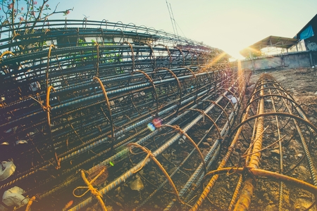 Rolls of wire mesh steel for construction put a pile on the groundの写真素材