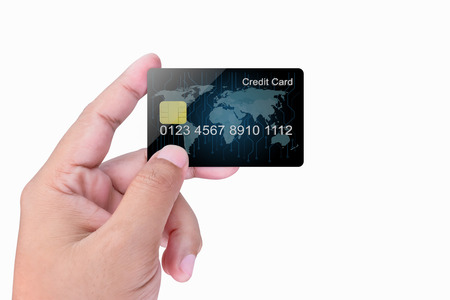 Credit Card holded by hand, close up, isolated on a white backgroundの写真素材