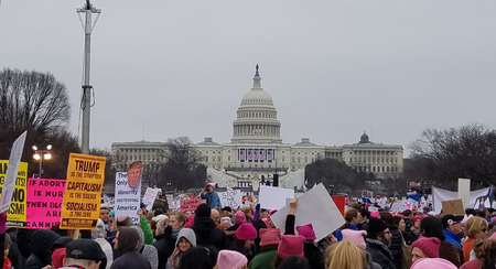 WASHINGTON, DC - JANUARY 21, 2017: Protesters hold up anti-Trump signs as thousands participate in the Women's March on Washington for social justice, the day after the Presidential Inauguration.のeditorial素材