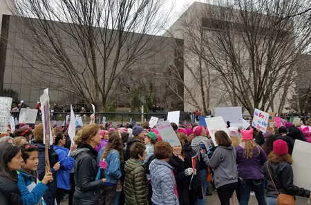 WASHINGTON, DC - JANUARY 21, 2017: Protesters hold up anti-Trump signs as thousands participate in the Women's March on Washington for social justice, the day after the Presidential Inauguration.のeditorial素材