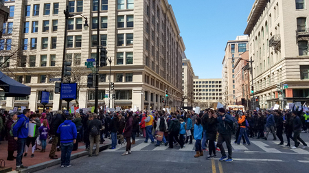 WASHINGTON, DC, USA - MARCH 24, 2018: People hold signs in the March For Our Lives, a student-led rally, demanding an end to gun violence and responsible firearm control legislation.のeditorial素材