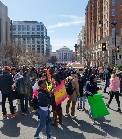 WASHINGTON, DC, USA - MARCH 24, 2018: People hold signs in the March For Our Lives, a student-led rally, demanding an end to gun violence and responsible firearm control legislation.のeditorial素材