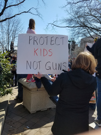 WASHINGTON, DC, USA - MARCH 24, 2018: People hold signs in the March For Our Lives, a student-led rally, demanding an end to gun violence and responsible firearm control legislation.のeditorial素材