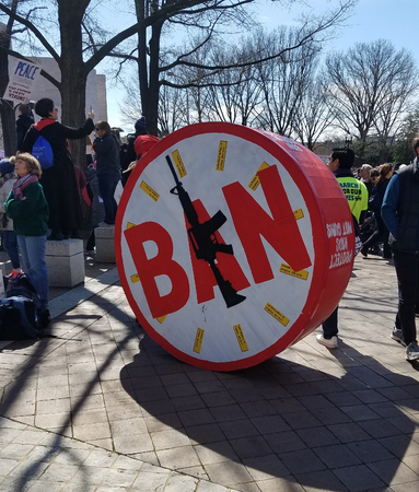 WASHINGTON, DC, USA - MARCH 24, 2018: People hold signs in the March For Our Lives, a student-led rally, demanding an end to gun violence and responsible firearm control legislation.のeditorial素材