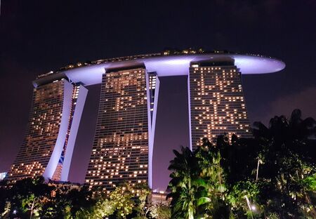 SINGAPORE - May 6, 2017: Nighttime view of the Marina Bay Sands luxury hotel, shopping mall and casino, from the adjacent Gardens by the Bay.のeditorial素材