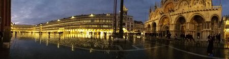 VENICE, ITALY - December 15, 2019: Nighttime view in a flooded San Marco Plaza during the high water...