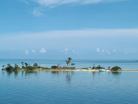 A serene seascape in the Florida Everglades National Park with calm blue waters and a clear sky, featuring distant islands on the horizon.の写真素材