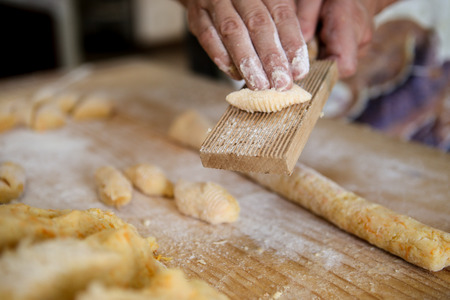 Cooking Italian homemade potato dumplingsの写真素材