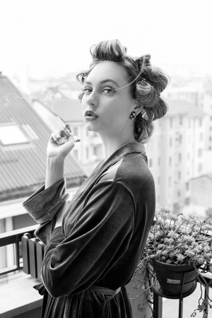 beautiful girl smokes a cigarette