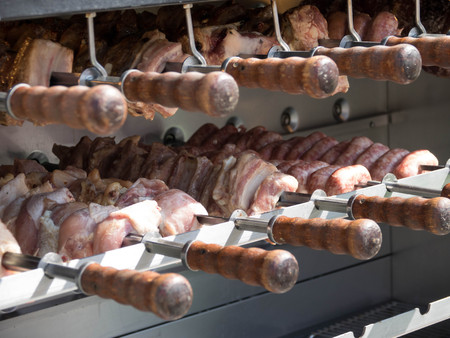Mixed variety of Meat on barbecue grill with coal. pig, sausages, BBQ grill on charcoal.の写真素材