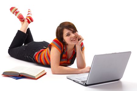 Yong student woman whit book and laptop isolated on whiteの写真素材