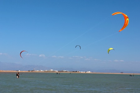 kites boards kiteboards sea surfers surf waterの写真素材