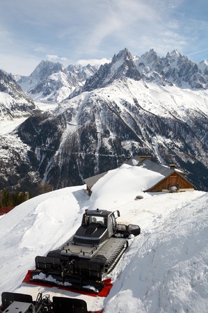 The house and tractor on a background of mountain tops of the French Alpesの写真素材