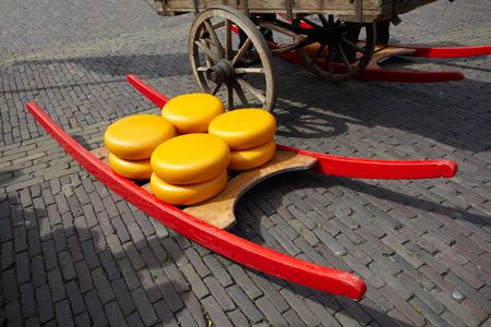 Stretcher with cheese in the market area of city Alkmaar, the Netherlandsの写真素材