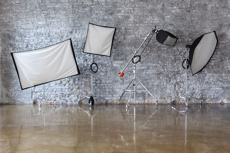 Four Light Stand with Softboxes on brick wall backgroundの写真素材