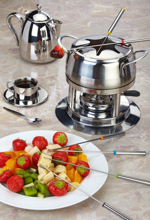 Fondue set with strawberries, fruit and chocolateの写真素材