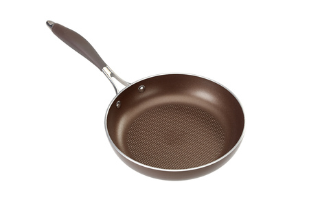 Brown coated Teflon frying pan isolated on white with fluted bottomの写真素材