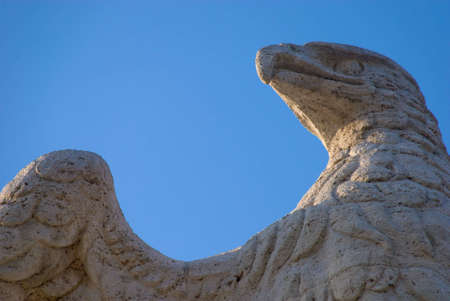 Close up of an old statue of an eagle in Rome, Italy.の写真素材