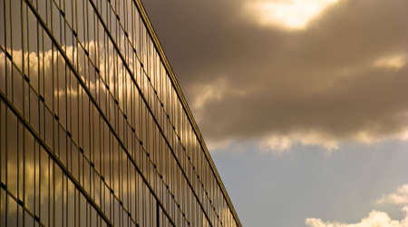 Glass modern building at sunsetの写真素材