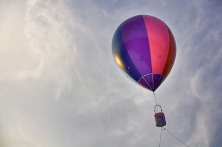 Colorful big balloon in the sky with evening lightの写真素材
