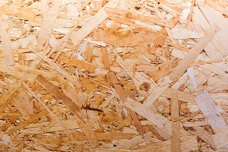 Background pressed plywood particleboard from sawdust of different sizes