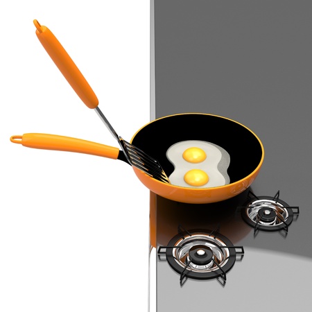 Cooking a fried eggの写真素材