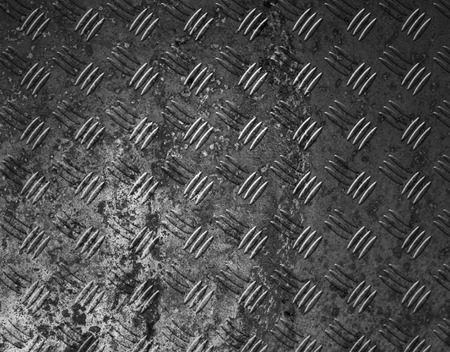 Metal background or texture of brushed steel plate with reflectionの写真素材