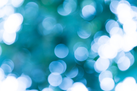 blue natural background of out of focus forest or bokehの写真素材