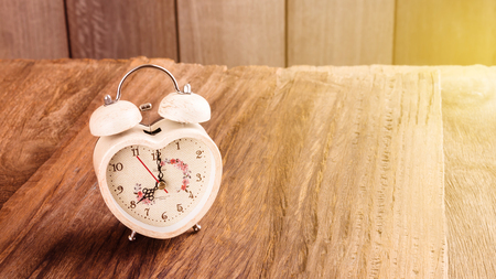 alarm clock on wood tableの写真素材