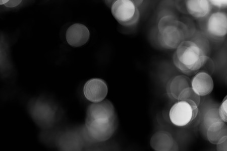 background black abstract bokeh for christmas night light holidayの写真素材