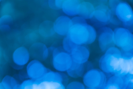 blue natural background of out of focus forest or bokehの写真素材