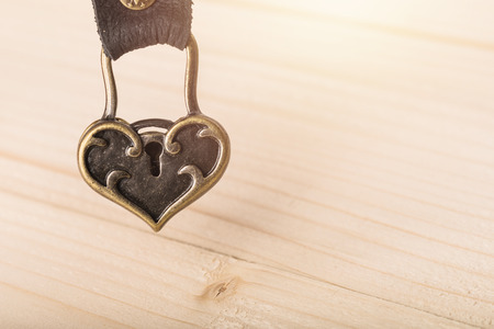 Valentines day background. Red heart on wooden table with copy spaceの写真素材