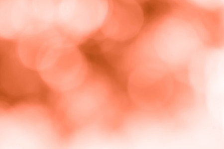 Blur orange leaves with bokeh, abstract backgroundの写真素材