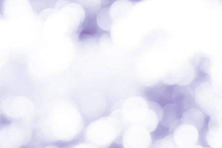 bokeh background with abstract blurred foliage and bright summer sunlight