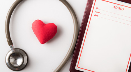 Valentines day background. Red heart on wooden table with copy space