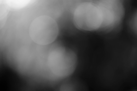 Black bokeh texture on black backgroundの写真素材