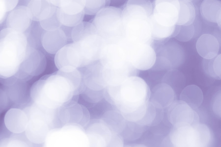 bokeh background with abstract blurred foliage and bright summer sunlight