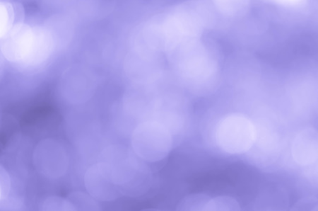 bokeh background with abstract blurred foliage and bright summer sunlight