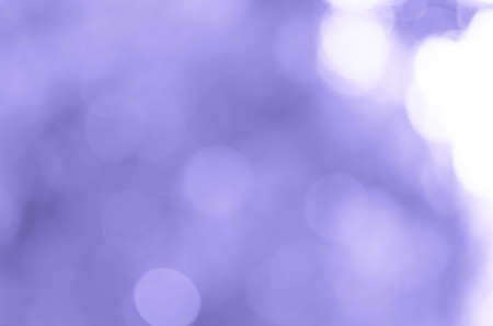 Bokeh background with abstract blurred foliage and bright summer sunlightの写真素材