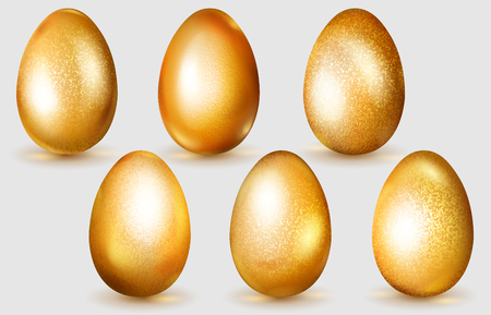 Set of realistic golden Easter eggs with glares and soft shadows on white backgroundのイラスト素材