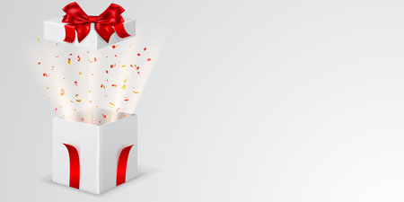Festive illustration with open white gift box with red ribbons and bow. Pieces of serpentine and rays of light fly out of itのイラスト素材